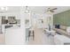 Bright and airy living room featuring modern finishes, sleek furniture, and an open floor plan to the kitchen at 7991 54Th N St, Pinellas Park, FL 33781