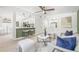 Open-concept living room seamlessly connects to the kitchen, offering a breakfast bar with modern stools at 7991 54Th N St, Pinellas Park, FL 33781