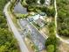 Aerial view of community pool, parking, pond, and landscaping at 8175 Sturbridge # 8175, Weeki Wachee, FL 34613