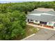 Aerial view of a well-maintained home with lush landscaping and a peaceful neighborhood at 8175 Sturbridge # 8175, Weeki Wachee, FL 34613