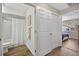 Bathroom includes a shower-tub combination with a curtain and a sliding door closet at 8175 Sturbridge # 8175, Weeki Wachee, FL 34613