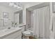Brightly lit bathroom features a vanity, a large mirror and a shower with tub combo at 8175 Sturbridge # 8175, Weeki Wachee, FL 34613