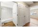 Bathroom with shower-tub combination and view into bedroom at 8175 Sturbridge # 8175, Weeki Wachee, FL 34613