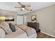 Bedroom featuring a comfy bed, a wooden dresser, and decorative wall art at 8175 Sturbridge # 8175, Weeki Wachee, FL 34613