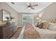 Bedroom boasts a large bed, wood floors, and sliding glass doors to the outside at 8175 Sturbridge # 8175, Weeki Wachee, FL 34613