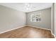 Bedroom featuring wood floors, a ceiling fan, and a bright window at 8175 Sturbridge # 8175, Weeki Wachee, FL 34613
