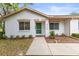 Inviting single-story home showcasing a well-manicured lawn and a welcoming front entrance at 8175 Sturbridge # 8175, Weeki Wachee, FL 34613