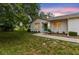 Charming single-story home with a well-maintained lawn and lush green landscape at 8175 Sturbridge # 8175, Weeki Wachee, FL 34613