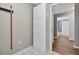 Hallway features storage closet and leads to a bathroom with a shower and toilet at 8175 Sturbridge # 8175, Weeki Wachee, FL 34613