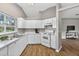 Well-lit kitchen with white appliances and a window overlooking the backyard at 8175 Sturbridge # 8175, Weeki Wachee, FL 34613
