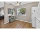 Bright kitchen area with lots of natural light, featuring white refrigerator and hardwood floors at 8175 Sturbridge # 8175, Weeki Wachee, FL 34613