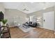 Inviting living room with vaulted ceiling, modern decor, and wood-look flooring at 8175 Sturbridge # 8175, Weeki Wachee, FL 34613
