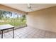 Screened patio with ceiling fan offers relaxing views of backyard at 8175 Sturbridge # 8175, Weeki Wachee, FL 34613