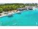 Aerial view of floating cabanas and seating in a resort-style pool for a relaxing community experience at 8192 Ivy Stark Blvd, Wesley Chapel, FL 33545