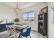 Dining room features a modern chandelier, large window, and stylish decor at 8192 Ivy Stark Blvd, Wesley Chapel, FL 33545