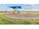 Community playground with slides and swings for to enjoy outdoor activities in a safe environment at 8192 Ivy Stark Blvd, Wesley Chapel, FL 33545