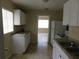 White cabinet kitchen featuring tile floors and granite-look countertops at 844 20Th S St, St Petersburg, FL 33712