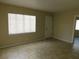 Bright living room featuring tile flooring, a window, and a door for easy access at 844 20Th S St, St Petersburg, FL 33712