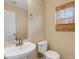 Cozy half bath with pedestal sink and window with bamboo blinds at 9013 White Sage Loop, Lakewood Ranch, FL 34202