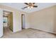 Bedroom with a ceiling fan and access to an ensuite bathroom at 9013 White Sage Loop, Lakewood Ranch, FL 34202
