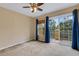 Spacious bedroom with large glass sliding doors leading to a private balcony at 9013 White Sage Loop, Lakewood Ranch, FL 34202