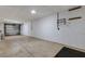 Spacious garage with an overhead light and ample room for parking and storage at 9013 White Sage Loop, Lakewood Ranch, FL 34202