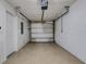 Spacious garage with a door and garage door opener offering ample storage and parking at 9013 White Sage Loop, Lakewood Ranch, FL 34202