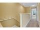 Bright hallway with carpet flooring and a stairway at 9013 White Sage Loop, Lakewood Ranch, FL 34202