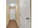 Clean hallway featuring neutral paint, tile flooring and a back door at 9013 White Sage Loop, Lakewood Ranch, FL 34202