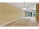 Spacious living room with natural lighting and a ceiling fan at 9013 White Sage Loop, Lakewood Ranch, FL 34202