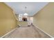 Living room space featuring carpet, natural light, and open floorplan at 9013 White Sage Loop, Lakewood Ranch, FL 34202