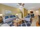 Bright living room with stylish furniture, soft rug, and modern decor at 9013 White Sage Loop, Lakewood Ranch, FL 34202