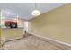 Cozy living room featuring neutral carpet and lighting fixtures at 9013 White Sage Loop, Lakewood Ranch, FL 34202