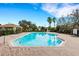 Beautiful community pool with a clear blue water, brick pavers and lounge chairs at 9013 White Sage Loop, Lakewood Ranch, FL 34202