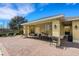 Relaxing poolside seating area with tables, chairs, and ceiling fans for community enjoyment at 9013 White Sage Loop, Lakewood Ranch, FL 34202