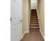 Bright stairwell with carpeted stairs and tile flooring on the ground level at 9013 White Sage Loop, Lakewood Ranch, FL 34202