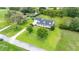 Spacious property with a well-maintained home, pool, and lush landscaping at 9830 Caribou Trl, Dade City, FL 33525