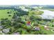 Aerial shot of a lovely home in a quiet neighborhood near lakes and green spaces at 9830 Caribou Trl, Dade City, FL 33525