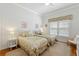 Charming bedroom with twin beds, floral accents, and shuttered window at 9830 Caribou Trl, Dade City, FL 33525