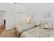 Bright bedroom featuring two twin beds, closet, and soothing decor create a comfortable and inviting space at 9830 Caribou Trl, Dade City, FL 33525