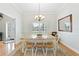 Dining room features a wooden table, six chairs, and a rug under the table at 9830 Caribou Trl, Dade City, FL 33525