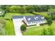 Attractive exterior view showcasing the home's facade, garage, and landscaped front yard at 9830 Caribou Trl, Dade City, FL 33525