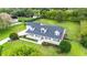 Charming two-story home with a well-manicured front yard and inviting porch at 9830 Caribou Trl, Dade City, FL 33525