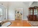 Inviting foyer showcasing hardwood floors and view into the dining room at 9830 Caribou Trl, Dade City, FL 33525