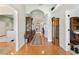 Wide foyer showcases hardwood floors, arched openings and access to other rooms at 9830 Caribou Trl, Dade City, FL 33525