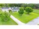 Charming single-Gathering home with a manicured front yard and long driveway at 9830 Caribou Trl, Dade City, FL 33525