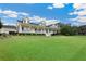 Spacious home with a long porch, beautiful greenery and large lawn at 9830 Caribou Trl, Dade City, FL 33525