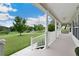 This home's covered front porch offers plenty of room for sitting and relaxing at 9830 Caribou Trl, Dade City, FL 33525