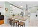 Modern kitchen with a large island, stainless steel appliances, and barstool seating at 9830 Caribou Trl, Dade City, FL 33525