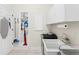 Functional laundry room with built in storage and lots of counter space at 9830 Caribou Trl, Dade City, FL 33525